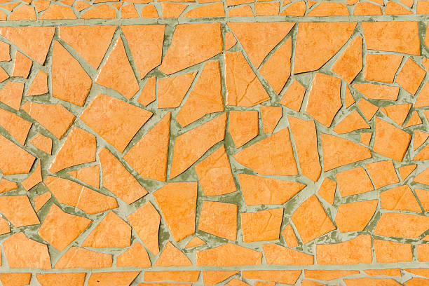 Yellow handmade mosaic work from broken tiles in Madeira stock photo