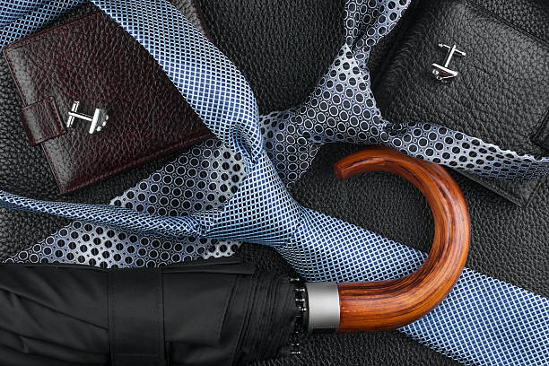 istock Wallet, tie, cufflinks, umbrella lying on the skin 512861925