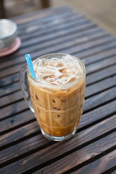 istock glass of milk-coffee on wood table 512862707