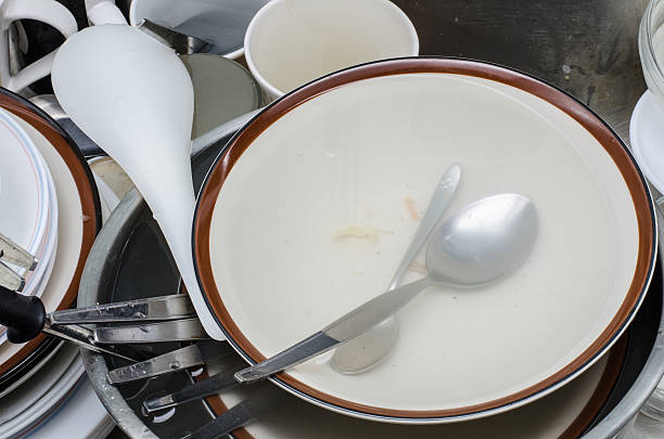 istock Dirty dishes in sink 512862823