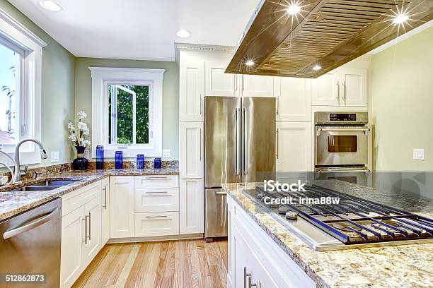 Kitchen Island With Builtin Stove Granite Top And Hood Stock Photo -  Download Image Now - iStock