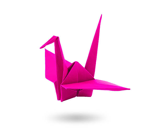 istock origami pink paper heart with swing on white background 512863921