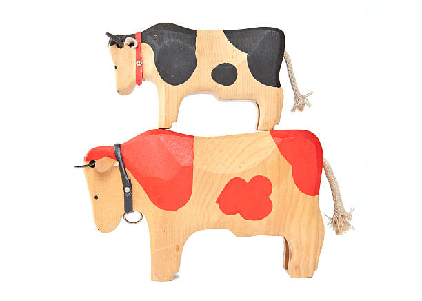 istock wood cow toy 512865313
