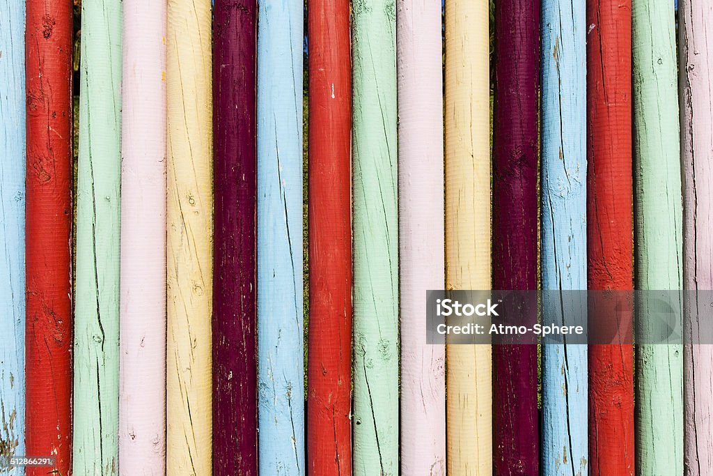 Very bright and colourful wooden fence in Madeira Very bright and colourfully painted wooden fence in Madeira Pole Stock Photo