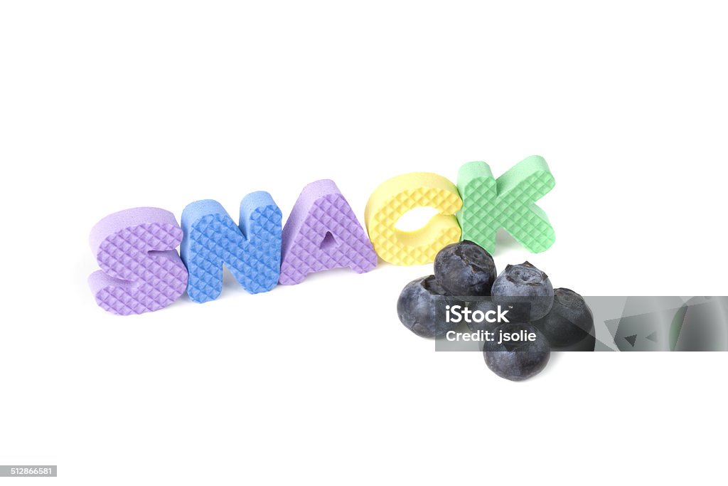 Snack time Six fresh blueberries and letters spelling "snack" isolated on white. Arranging Stock Photo