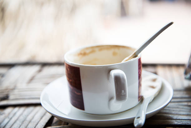 istock Cappuccino coffee cup closeup at the table 512881018