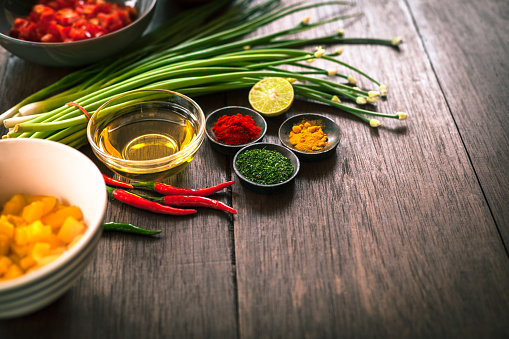 Various of spices and vegetable on dark rustic wooden background