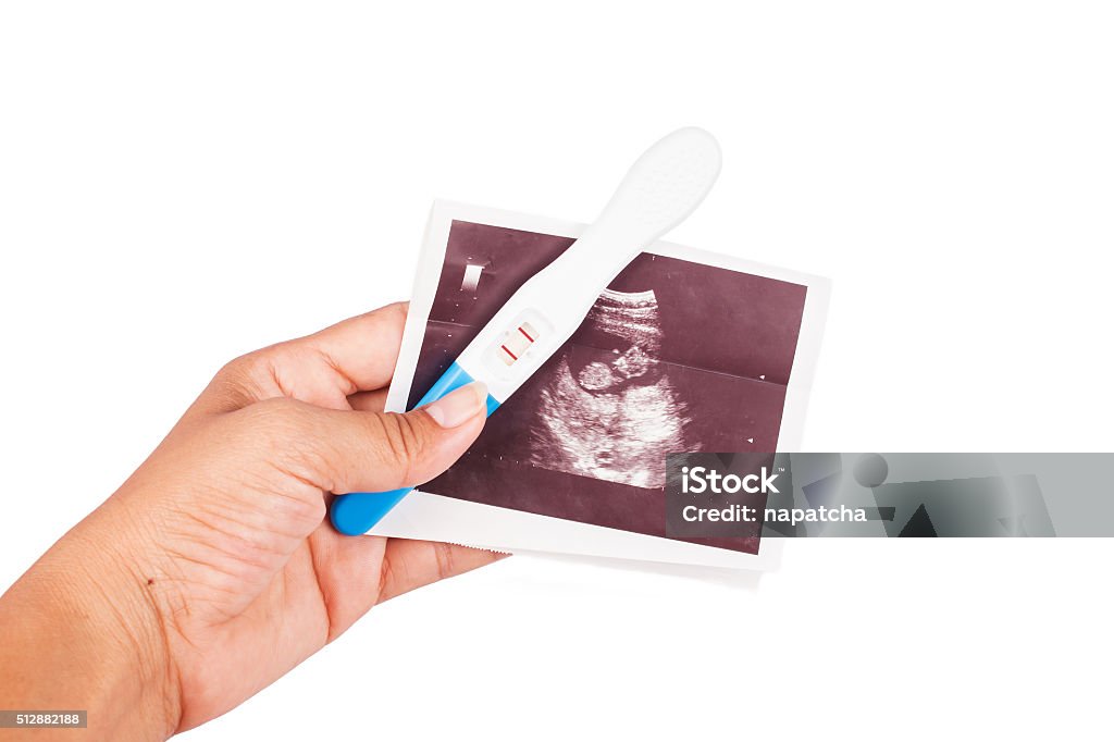 hand hold ultrasound and pregnancy test Adult Stock Photo