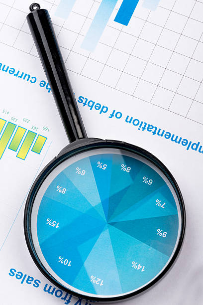istock Magnifying glass lies on the statement printed paper 512882628