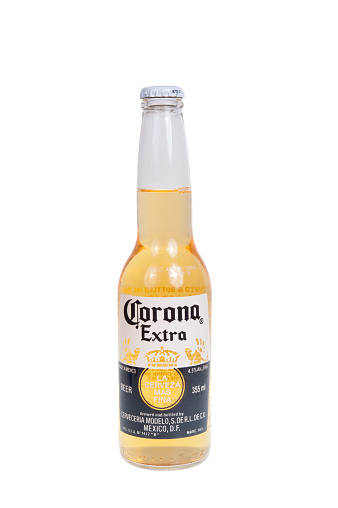Adelaide, Australia - December 12, 2015: A bottle of Corona Extra Beer isolated on a white background. Corona Extra is a pale lager made in Mexico and exported throughout the world. Corona Extra is one of the highest selling beers in the world produced by Cervecería Modelo in Mexico.