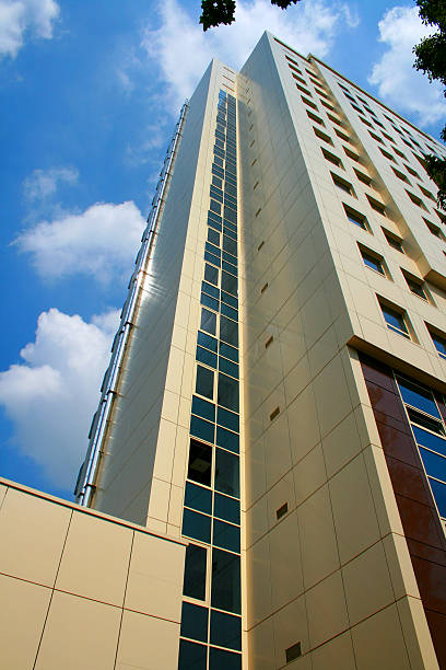 istock modern business building against blue sky 512886328