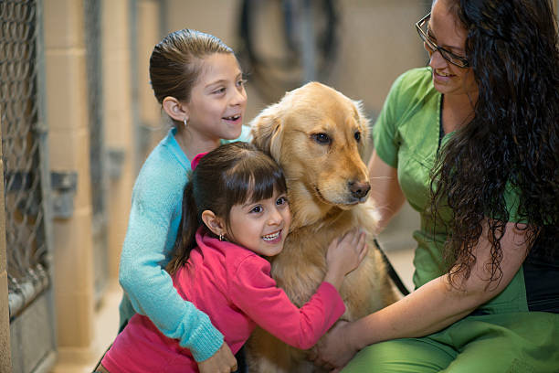 istock Children Hugging a Rescued Animal 512887140
