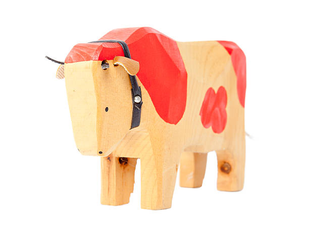 istock wood cow toy 512887373