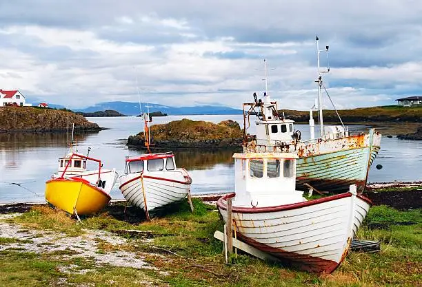 Fishing boats on the shore of  a bay  in Skykkisholmur,Snaefellsnes,Iceland.