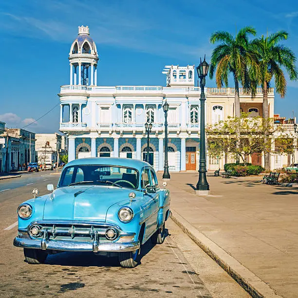 Old American vintage car parking on the town square in Cienfuegos