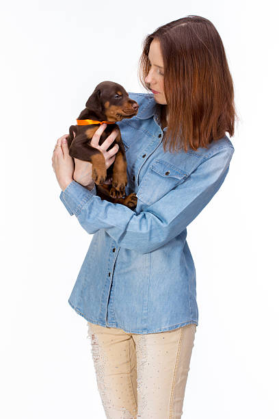 istock Red girl with puppy 512888980