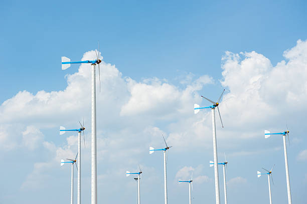 istock Eco energy - wind turbines ,blue sky background 512889402