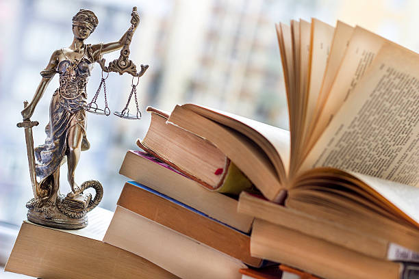 istock Justice statue with sword and scale and books. Law concept 512889412