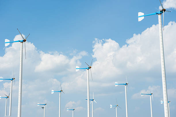 istock Eco energy - wind turbines ,blue sky background 512889462