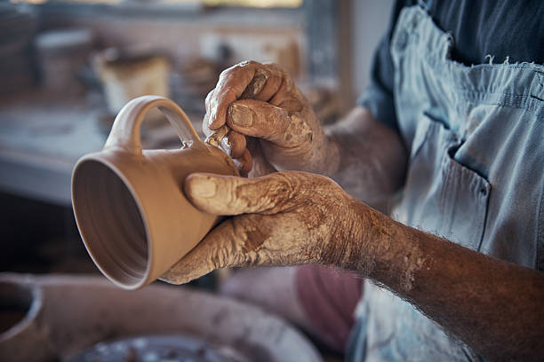 Every cup he makes is unique Cropped shot of a craftsman working on his pottery in his workshopimage806442.jpg craftsperson stock pictures, royalty-free photos & images
