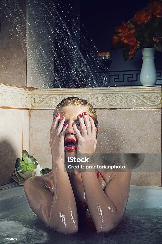 Crime story Beautiful girl is taking shower in the bathtub Adult Stock Photo