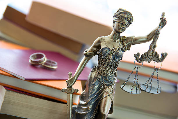 Family law. Justice statue with sword and scale stock photo