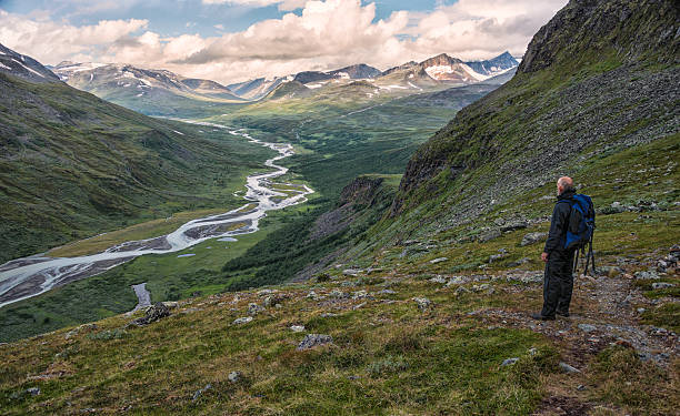 istock Hiker in vast landscape overlooking valley 512893621