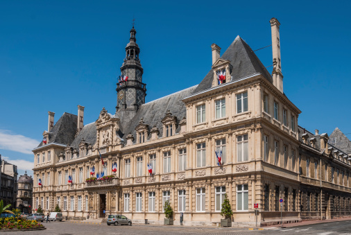 Hotel de Ville, Reims, France with French flags flying for Bastille Day.