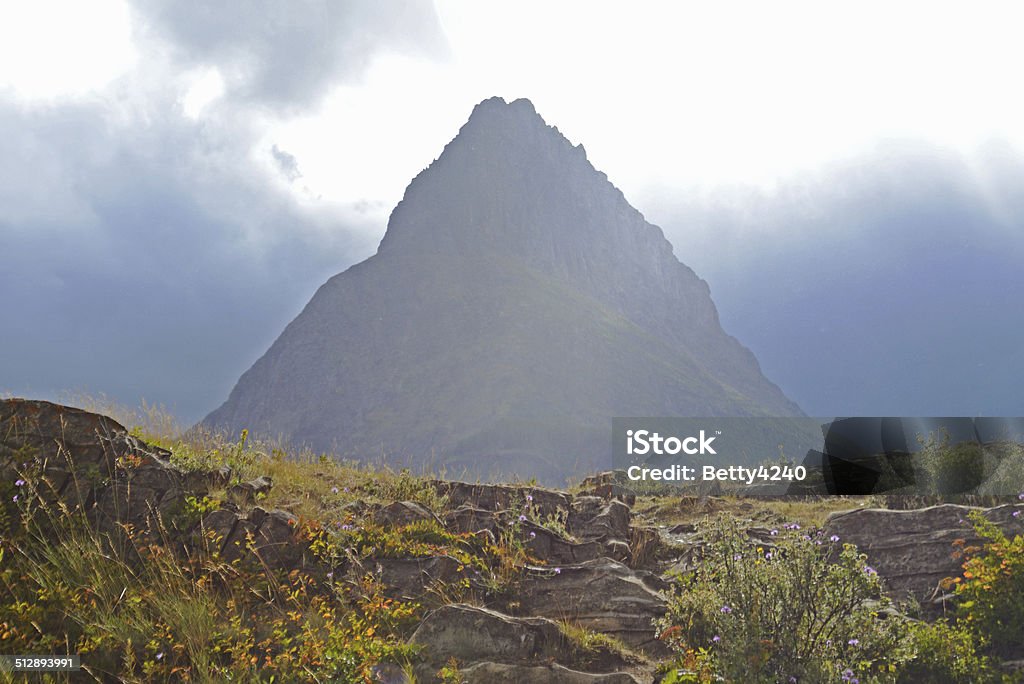 Storm light on mountains and peaks in Glacier National park. light, mountains, peaks Beauty In Nature Stock Photo