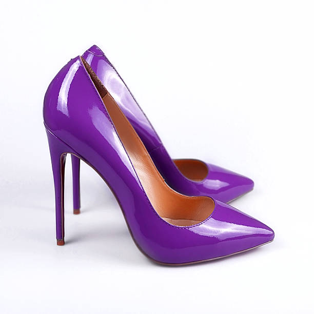 istock Purple female shoes on a white background 512898010