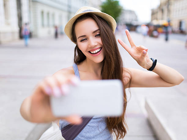 istock Young woman taking selfie 512898166