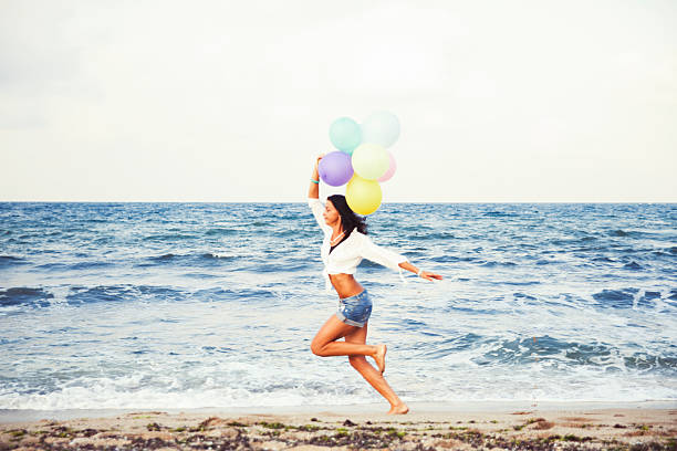 istock Woman runningon the beach 512899104