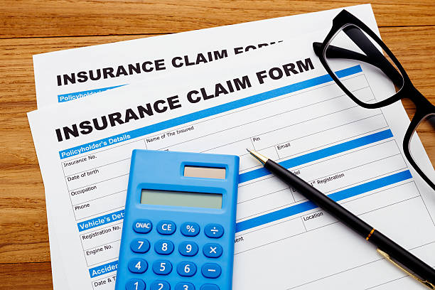 istock Insurance claim form with calculator 512899226