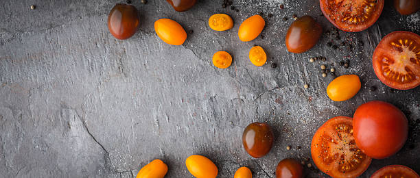 istock Tomatoes mix  with seasoning on the stone table  wide screen 512900336