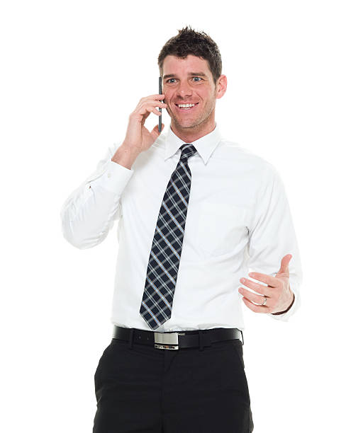istock Smiling businessman talking on phone 512900456