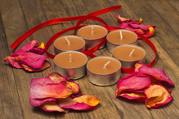 five incense sticks  and dry rose petal flat lay