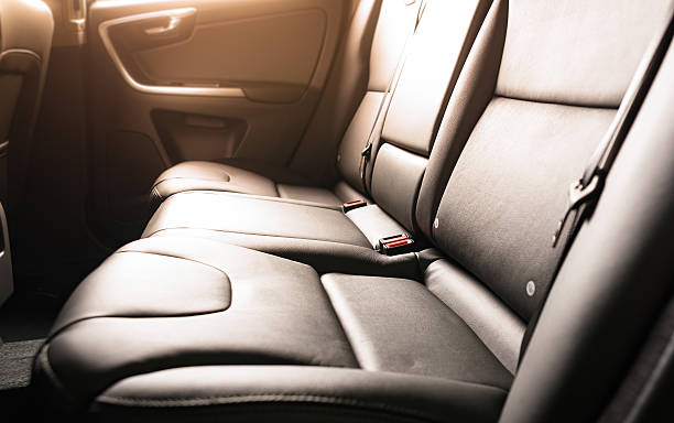 back passenger seats Car backseats with sun light flare from the window car interior stock pictures, royalty-free photos & images