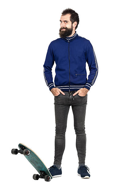 istock Funny expression of happy hipster in tracksuit standing on skateboard 512906516
