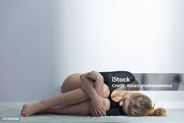 Girl Suffering From Menstrual Cramps Stock Photo - Download Image Now - Pain, Adult, Bicycle