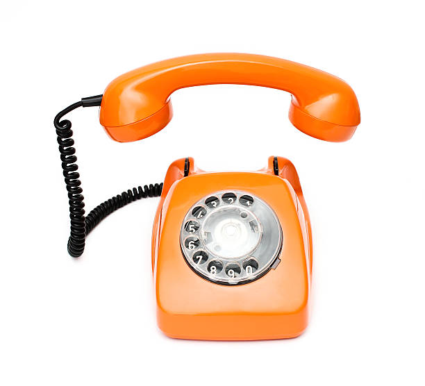istock Orange retro telephone isolated on white background. 512908392