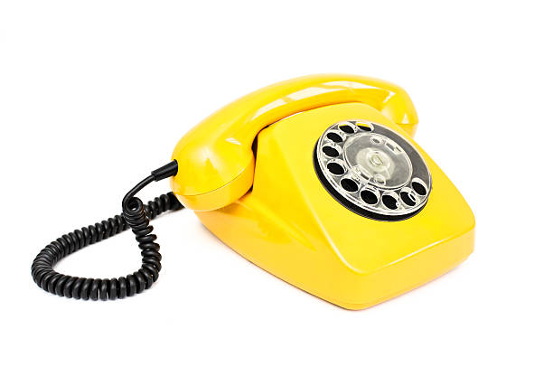 istock Yellow retro telephone isolated on white background. 512908420