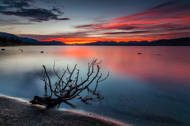istock Amazing red sunset over a mountain lake. 512909574