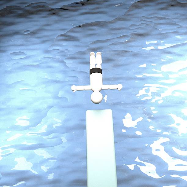istock Diver diving in water from trampoline 512911580