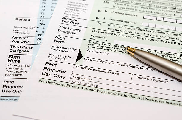 istock blank tax form with pen 512912310
