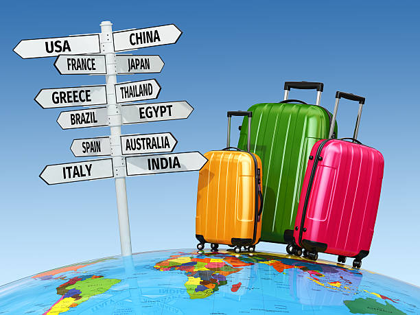 istock Travel concept. Suitcases and signpost with countries. 512917177