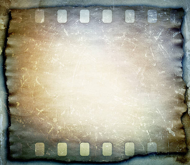 istock grunge scratched film strip background 512918525