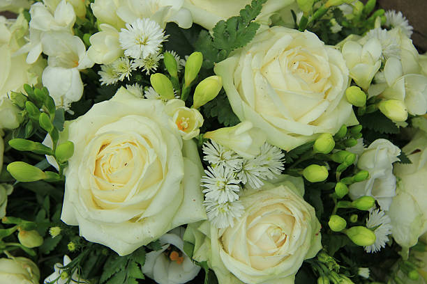 istock White roses in bridal bouquet 512919053