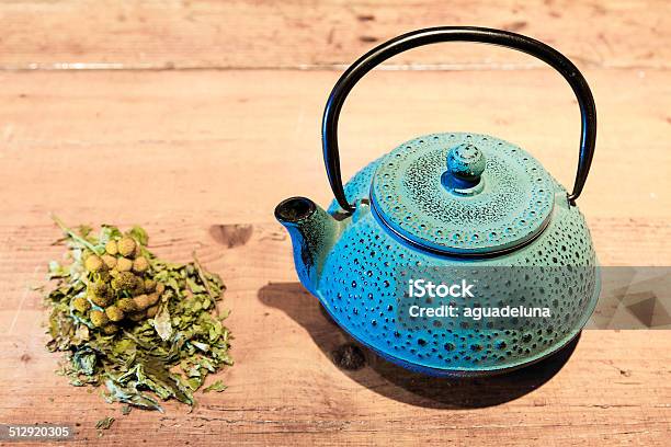 Blue Teapot And Chamomile Plant Stock Photo - Download Image Now - Aromatherapy, Backgrounds, Breakfast