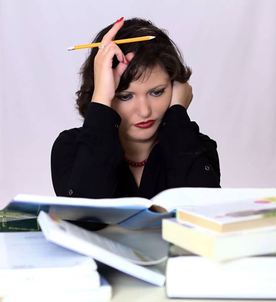 istock Young women student doing home work with pencil and books 512920327