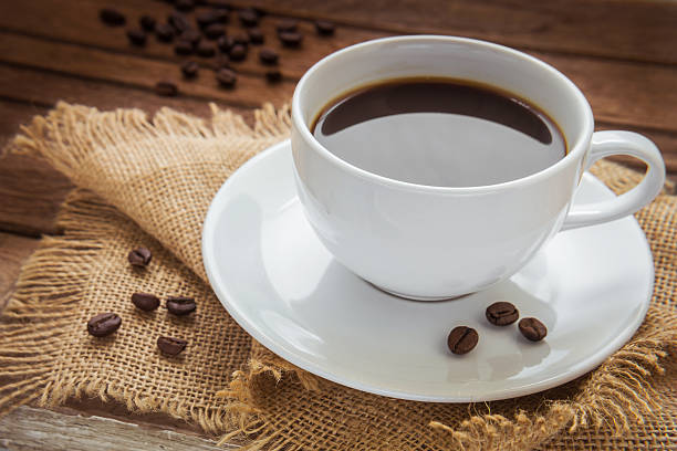 istock coffee cup and coffee beans on sackcloth 512921031